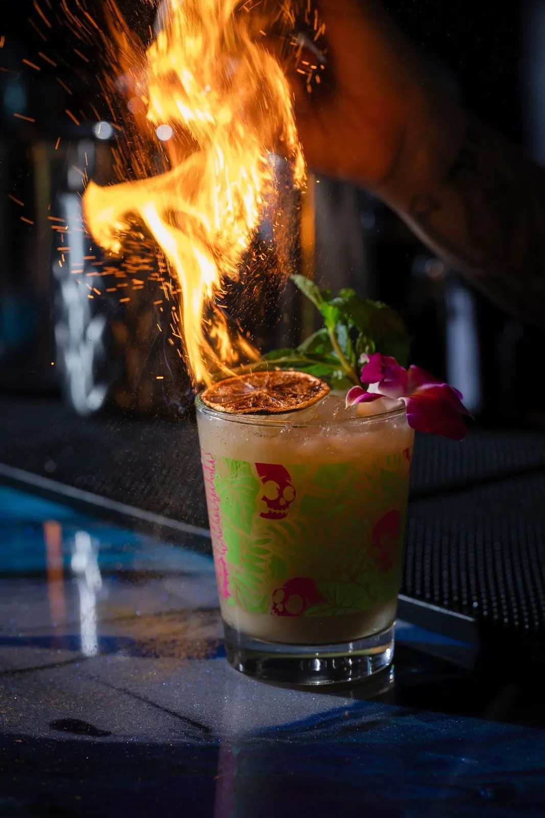 A flaming cocktail in a skull glass